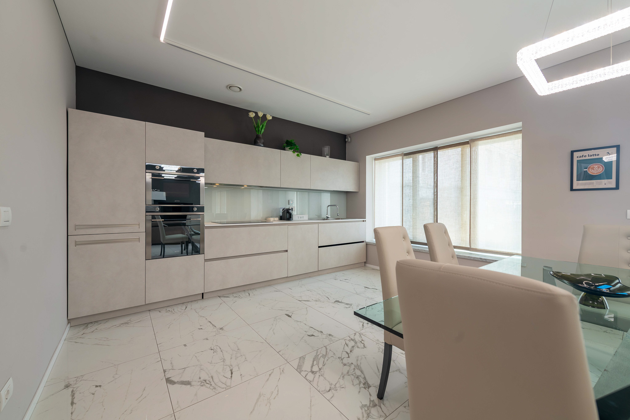 Linear kitchen with appliances and dining area