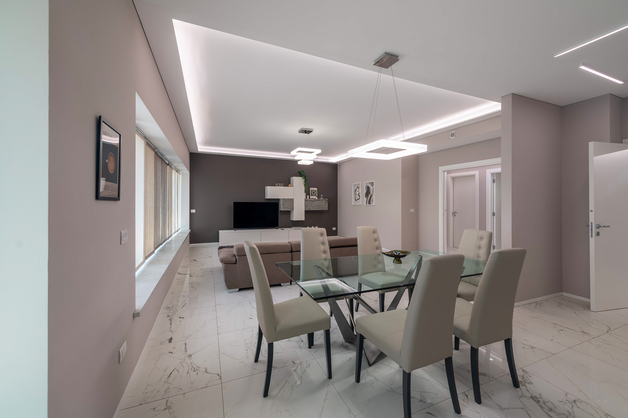 Dining room with crystal table and six chairs