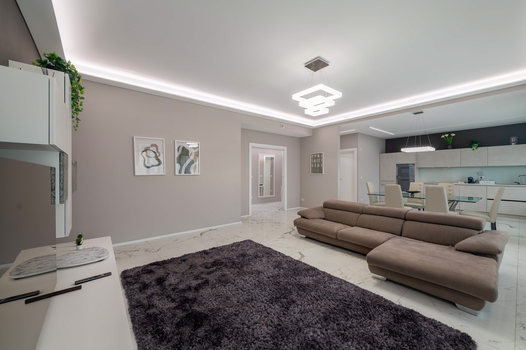 Open-space with living, dining and kitchen in the background