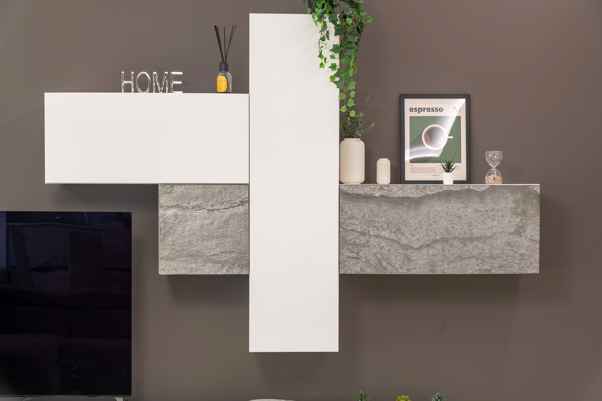 Detail of suspended TV unit with print and decor
