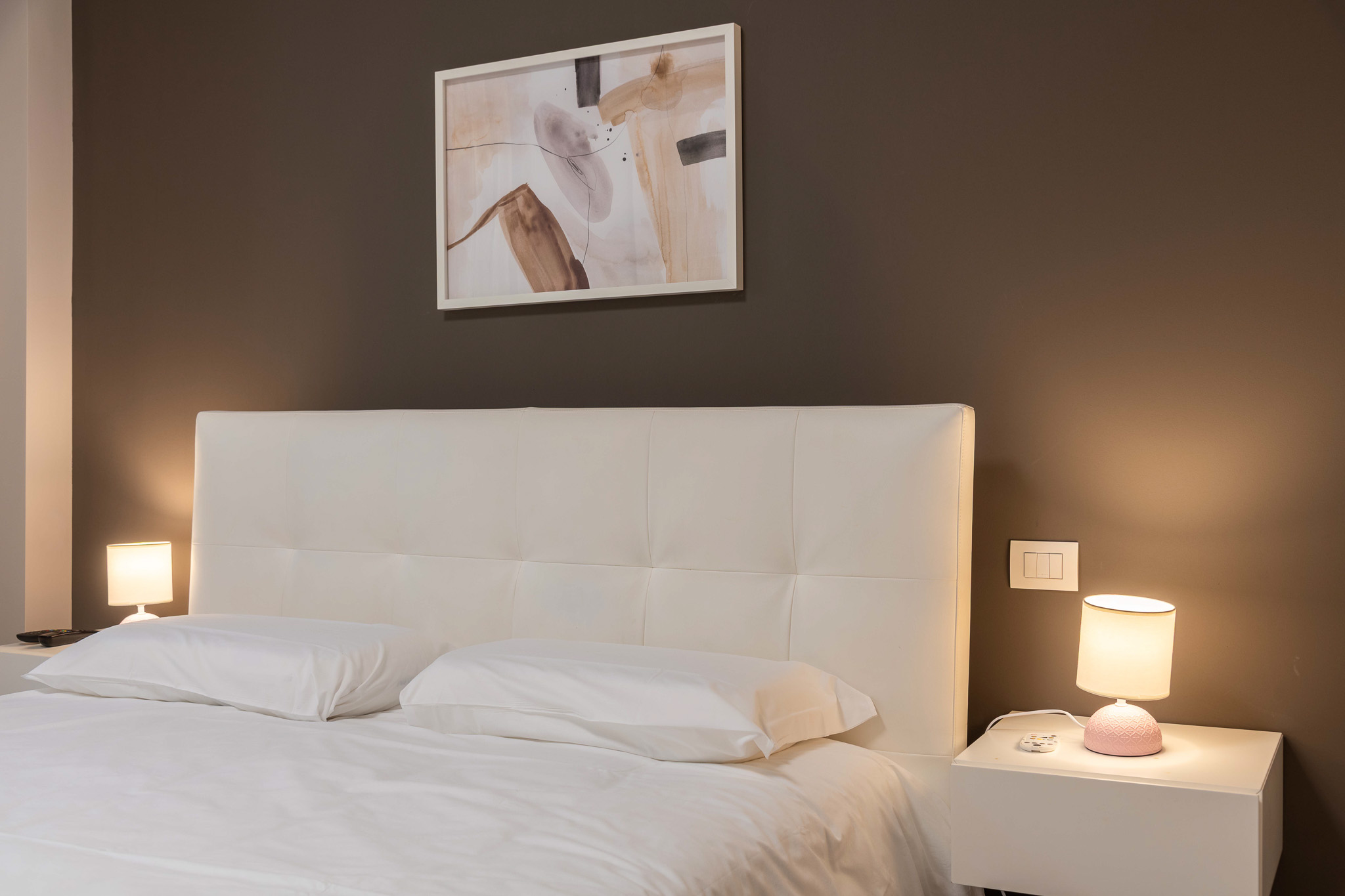 Master bedroom in the evening with warm lights on